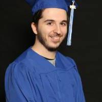 man in blue cap and gown